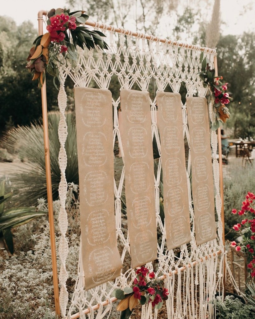 Boho macrame wedding table seating chart in natural tones