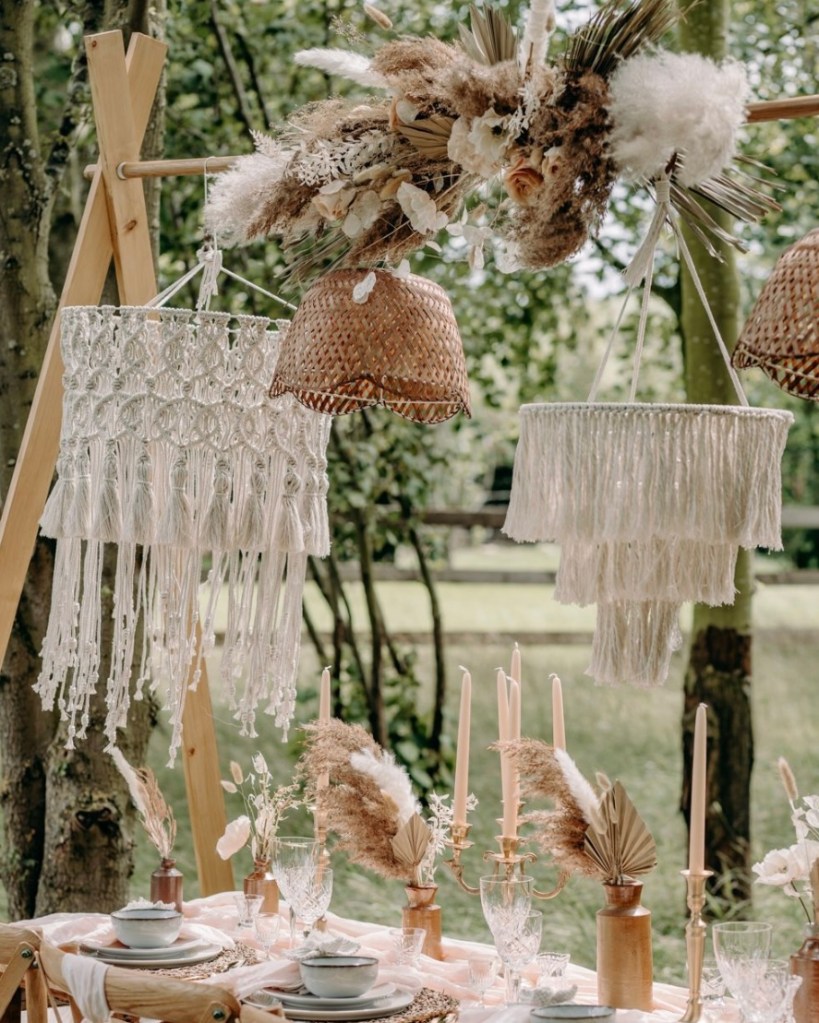 boho wedding table decor with large macrame laterns hanging over the table
